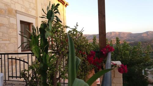 a view from a balcony with plants and flowers at Kritamos Villa & Apartments in Kamilari