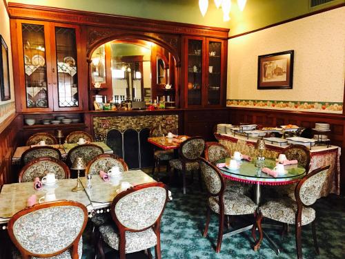 a dining room with tables and chairs in a restaurant at The Redstone Inn and Suites in Dubuque