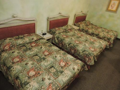 Hotel Quinta Cesarにあるベッド