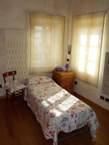 House Versilia Luca E Giada, 5 chilometri da Forte dei Marmi!にあるベッド