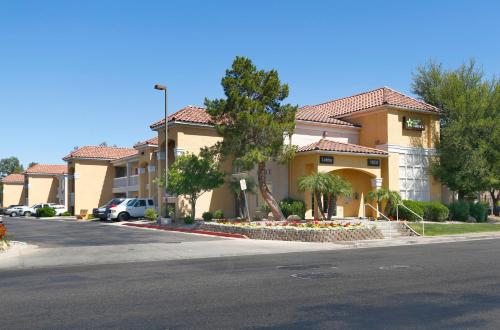 a large building with a street in front of it at Extended Stay America Suites - Phoenix - Mesa - West in Mesa
