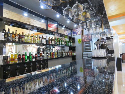 a bar with a lot of bottles of alcohol at Hotel Foisor in Bucharest