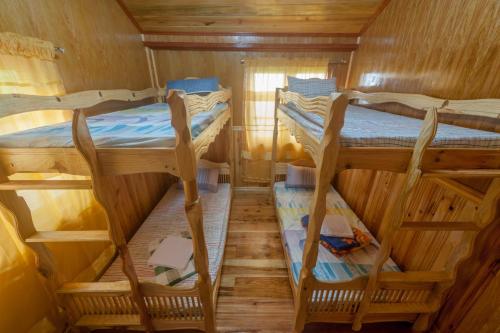 a small room with two bunk beds in it at Rice Homestay in Banaue