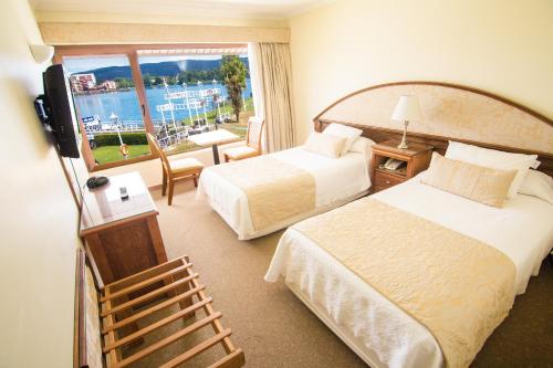 Postel nebo postele na pokoji v ubytování Hotel Marina Villa del Rio