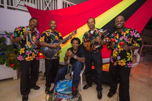 a group of men in hawaiian shirts playing instruments at Hotel Casablanca in San Andrés