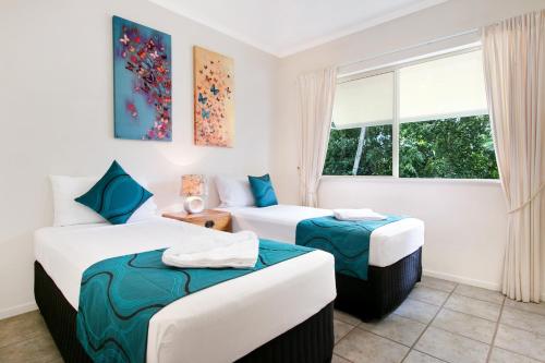 Ένα ή περισσότερα κρεβάτια σε δωμάτιο στο On The Beach Apartments