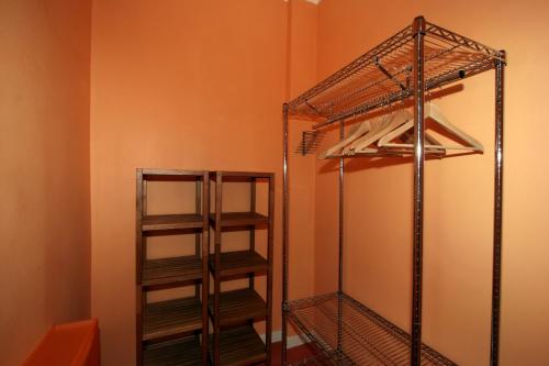 a walk in closet with two wooden shelves at Residence Pian della Nave in Milan