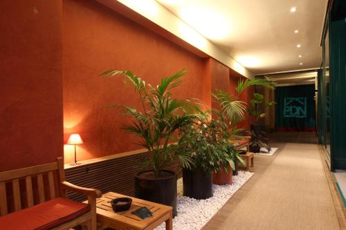a hallway with potted plants in a building at Residence Pian della Nave in Milan