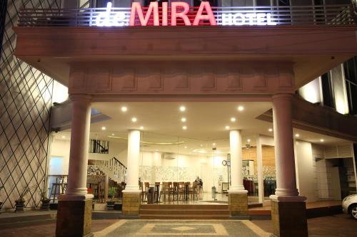 a store front with a sign on top of it at DeMira Hotel in Surabaya
