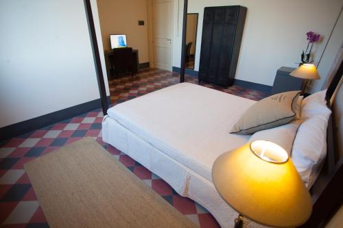Tempat tidur dalam kamar di Le stanze del Capostazione