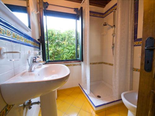 a bathroom with a sink and a shower at Case Vacanza la Ventura in Massarosa