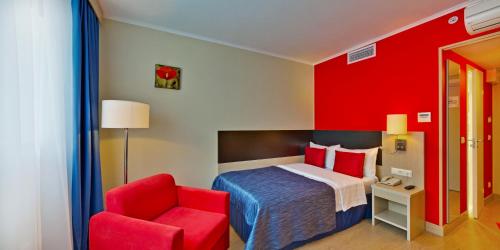 Кровать или кровати в номере Гостиница Севастополь Модерн