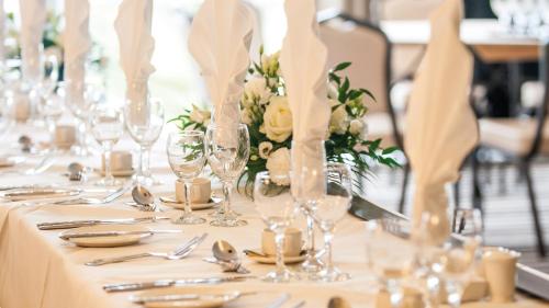 a table set for a wedding with glasses and flowers at The Park Hotel in Barnstaple
