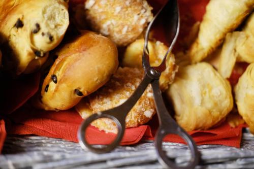 a pair of scissors sitting on a pile of food at Hôtel Malar in Paris