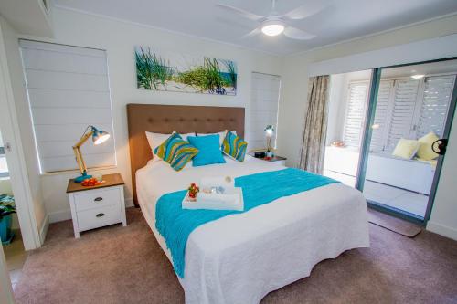 A bed or beds in a room at Coral Sands