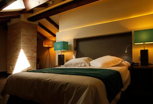 Cama o camas de una habitación en Hotel Spa Martín el Humano