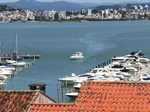 a group of boats docked at a marina at Hostel Berghaus in Florianópolis