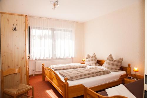 Postel nebo postele na pokoji v ubytování Haus Cristallo