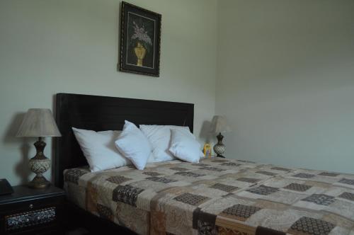 Postel nebo postele na pokoji v ubytování Stargaze Hotel & Apartment