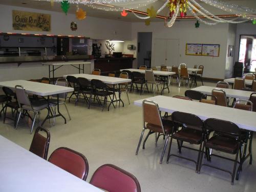 a classroom with tables and chairs in a room at San Benito Camping Resort Cottage 10 in Paicines