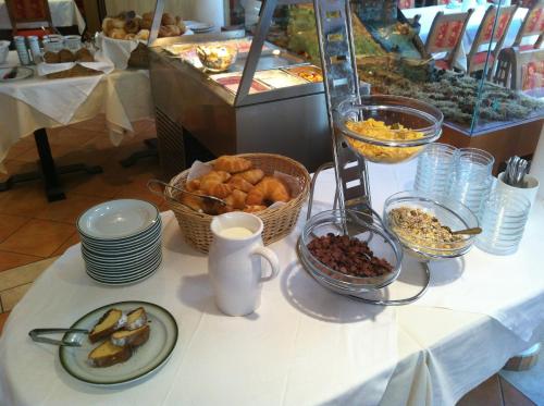 a table topped with plates and bowls of food at Werfenerhof in Werfen