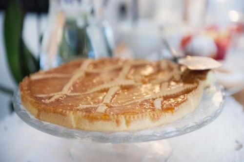 a chocolate pie on a glass plate on a table at A due Passi in Forte dei Marmi
