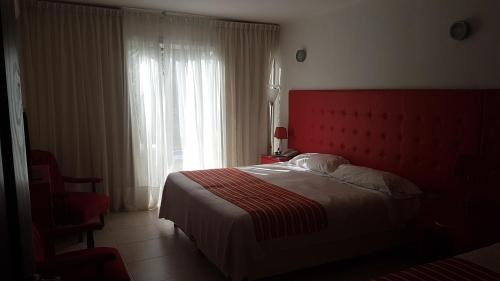 Una cama o camas en una habitación de Hotel Ríomío HABILITADO