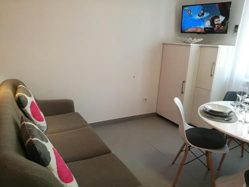 En tv och/eller ett underhållningssystem på Apartments Benika