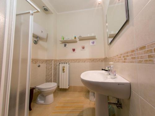 a bathroom with a sink and a toilet at B&B Lamezia Terme in Lamezia Terme