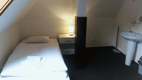 Säng eller sängar i ett rum på Penzion Marion