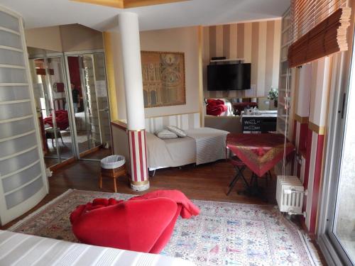 a living room with a red couch and a living room at Forte House in Milan