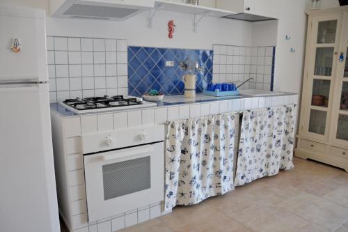 Kuchyň nebo kuchyňský kout v ubytování Il Porto