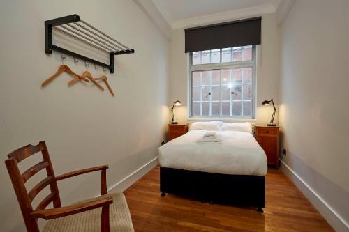 Ένα ή περισσότερα κρεβάτια σε δωμάτιο στο Green Rooms