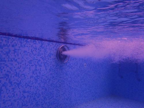 a person in a swimming pool with a water ball at Apartments Đurašević in Sveti Stefan