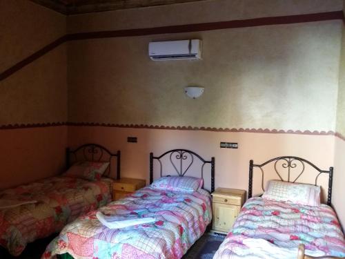 Postel nebo postele na pokoji v ubytování Hotel Mandar Saghrou Tazakhte