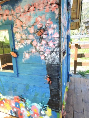 a painting of butterflies on the side of a house at Haus Mösenlechner in Maishofen