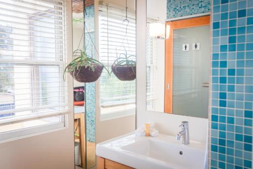 a bathroom with a sink and a mirror at La Casa Del Camino in Laguna Beach