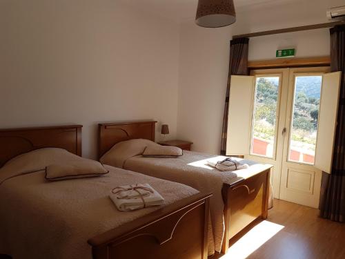 Кровать или кровати в номере Olhares do Douro