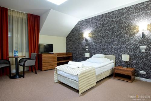 Un ou plusieurs lits dans un hébergement de l'établissement Hotel Lord Krosno