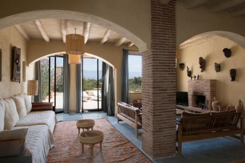 a living room with a couch and a table at Dar al Hossoun in Taroudant