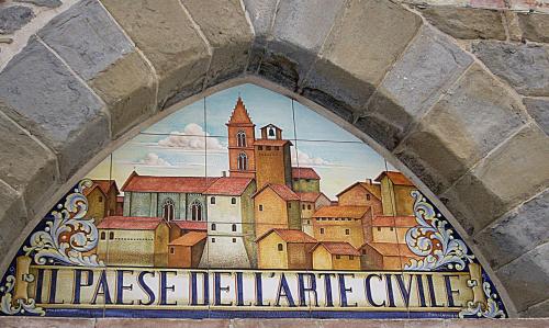 a painting of a city in a window at Casa "Le tre Muse" in Deruta