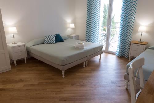 מיטה או מיטות בחדר ב-Zenzero e Limone