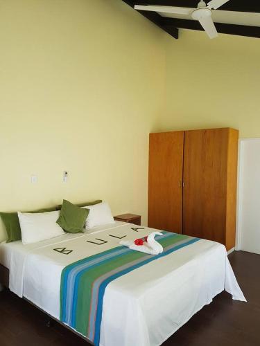 Katil atau katil-katil dalam bilik di Daku Resort