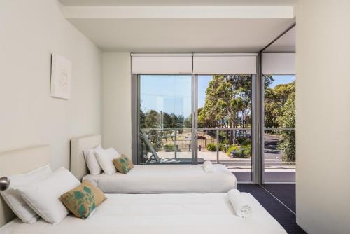 Postel nebo postele na pokoji v ubytování Coast Resort Merimbula