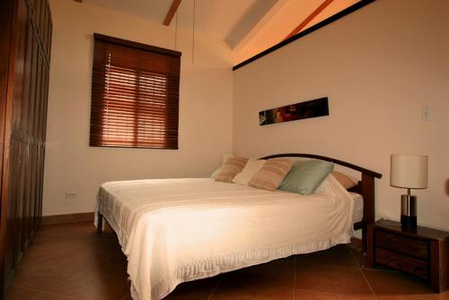 A bed or beds in a room at Punta Chame Club and Resort