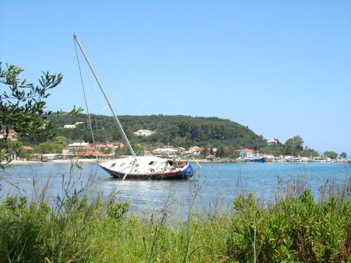 a sail boat sitting in the water on a lake at Pension Elena in Ágios Nikólaos