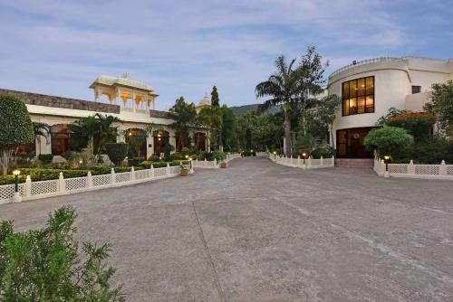 a large building with a driveway in front of it at The Udaibagh in Udaipur