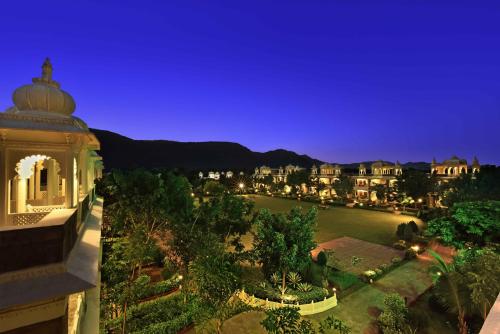 a view of a city at night at The Udaibagh in Udaipur