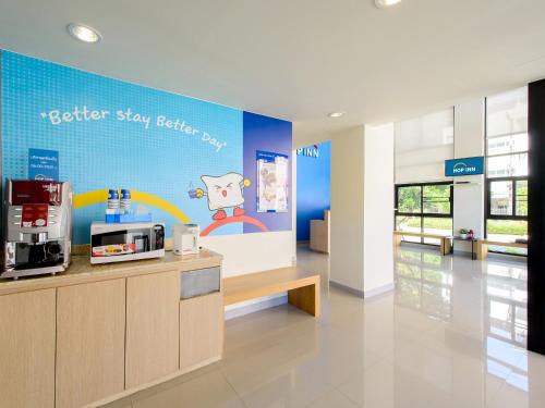 a coffee shop with a sign that reads better stay better pay at HOP INN Khon Kaen Srichan Road Building A in Khon Kaen