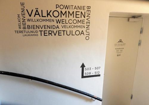a wall with a sign on the side of a room at Go to sleep Arvika in Arvika